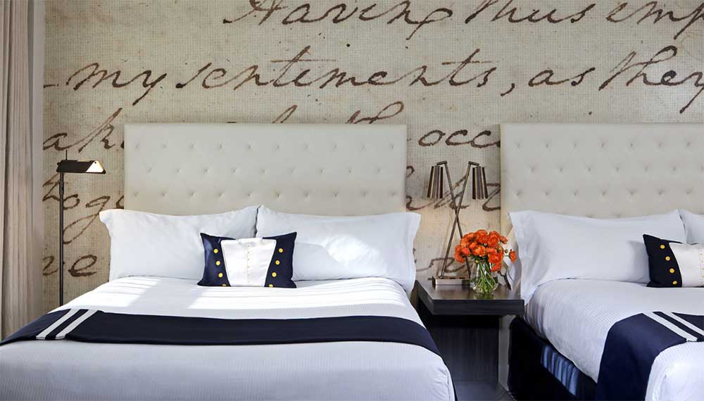 2 Queen beds in Kimpton George Hotel guestroom