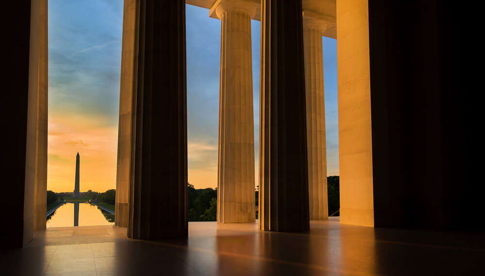 Early morning summer sunrise as seen from the Lincoln Memorial while looking toward the Washington Monument in Washington, DC