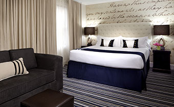 modern guestroom at Kimpton George Hotel